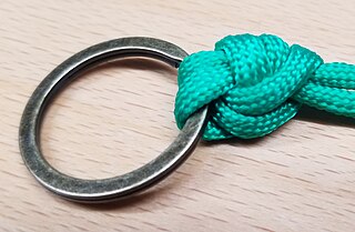 Palomar knot tied with fishing line through a hook eye
